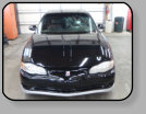 A Chevrolet Monte Carlo that had a previous poor workmanship windshield installation in cold weather.
